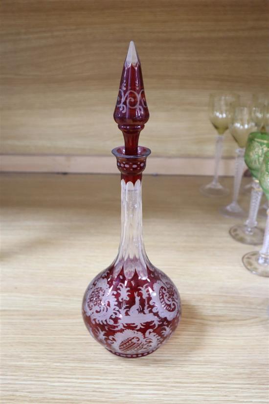 A Bohemian ruby flash glass decanter and stopper, cranberry glass, including a pair of tazzas, a collection of hock glasses, etc.